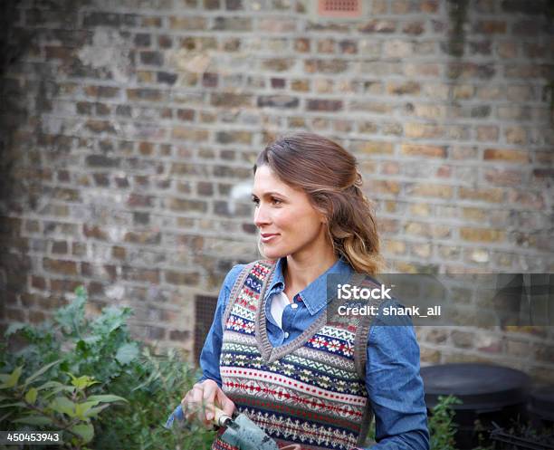 Women In Garden Stock Photo - Download Image Now - Sweater Vest, One Woman Only, 30-34 Years