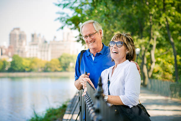 Senior Couple in Central Park Senior Couple enjoying the afternoon in central park, New York. United States. upper east side manhattan stock pictures, royalty-free photos & images