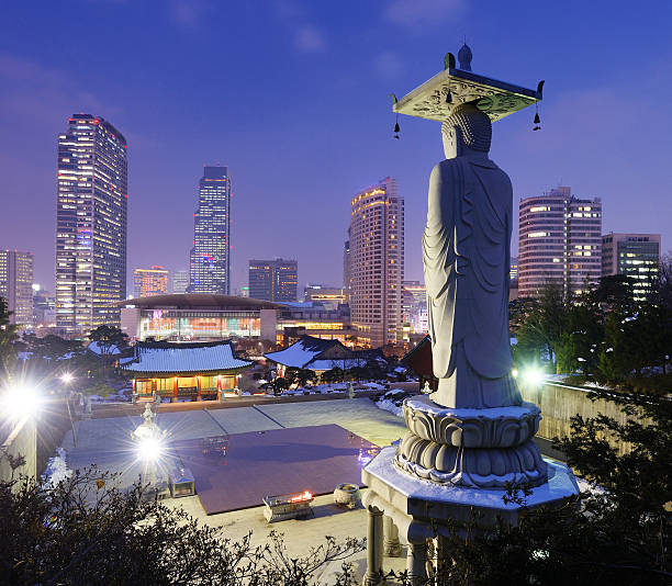 istock Seoul skyline at night with statue 450468085