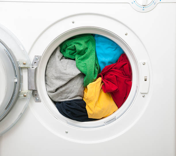 istock Washing Machine filled with vibrant fabric 450468483