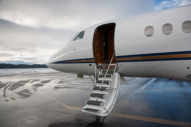 istock Business jet at airport with stairs lowered 450473391