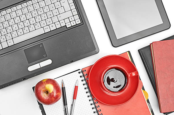 istock Laptop and office supplies on white 450478311