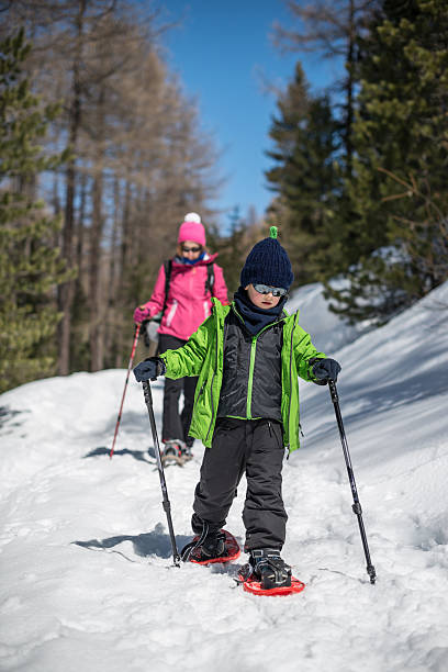istock Mother and Son Snowshoeing 450481555