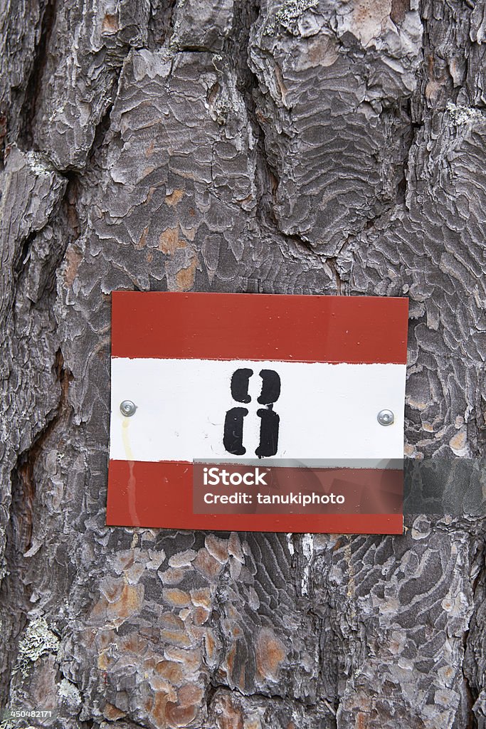 Trail Sign Plate An hing trail sign plate fixed on a trunk. Color Image Stock Photo