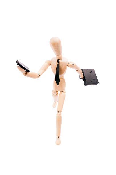 istock bussiness man running looking to his cellphone with clipping path 450490957