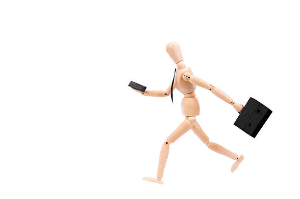 istock bussiness man running looking to his cellphone with clipping path 450496975