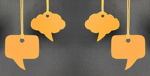istock Speech bubbles hanging in orange color 450506691