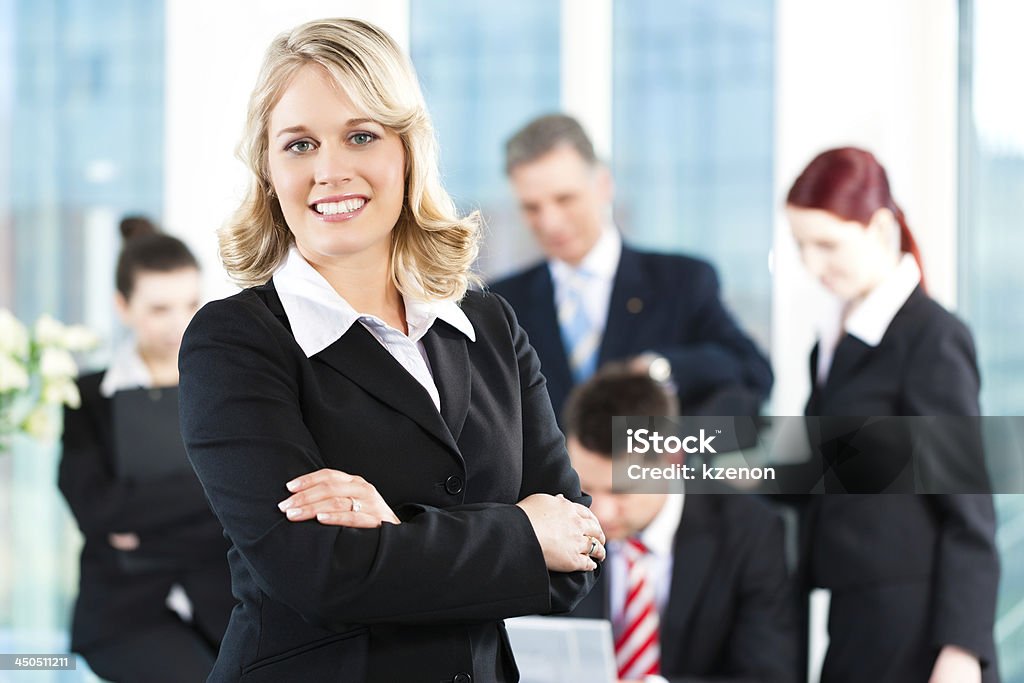 Business - meeting in office Business - meeting in an office, a colleague is looking into the camera Adult Stock Photo