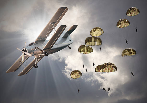 Retro style picture of the biplanes with airborne infantry.