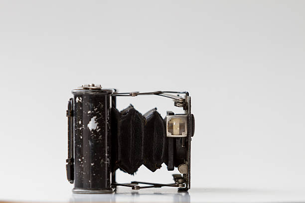 istock Isolated old vintage analog black camera detail close up. 450514585
