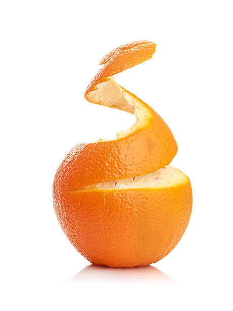 istock orange with peeled spiral skin 450516785