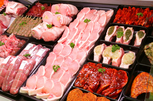 A selection of pork on display in a butchers shop