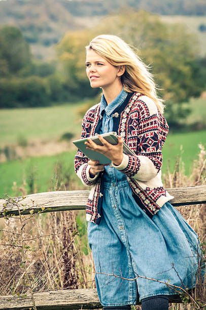 istock Young woman outdoor with her tablet - I 450519099