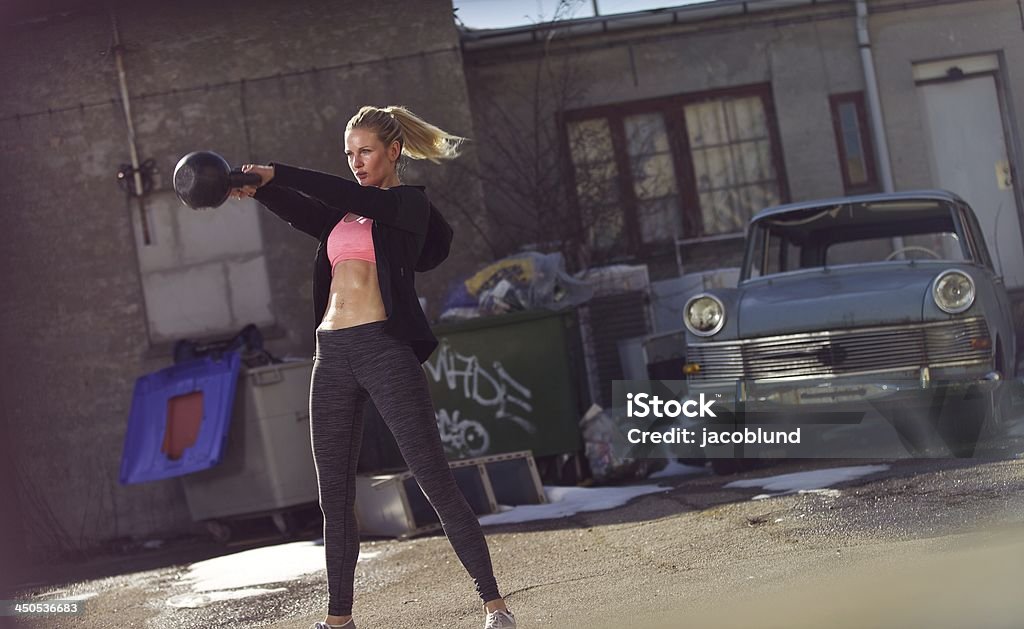 Workout for a Healthy Lifestyle Female athlete in a gym workout outdoors Abdominal Muscle Stock Photo