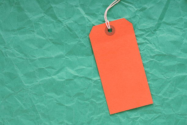 istock Orange Luggage Tag on Green 450537319