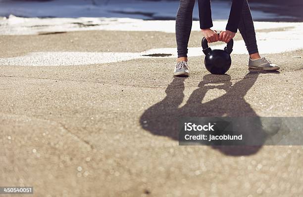 Shadow Of A Trainer Lifting Kettlebell Stock Photo - Download Image Now - Active Lifestyle, Adult, Adults Only