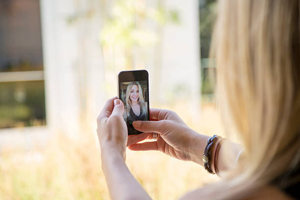 istock Girl Taking a Selfie on Mobile Phone 450547197