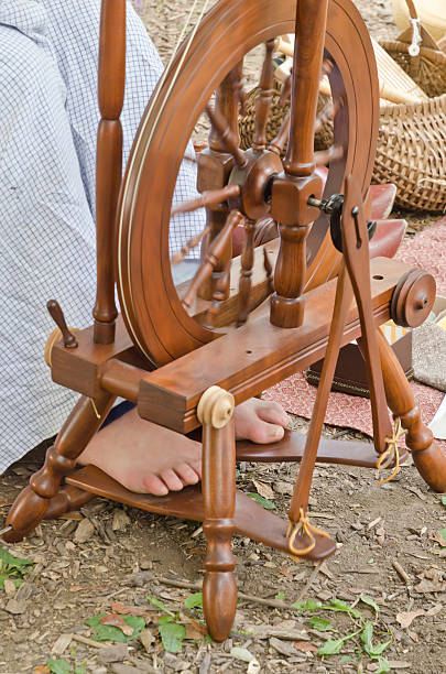 Woman's feet on treadle during military reenactment