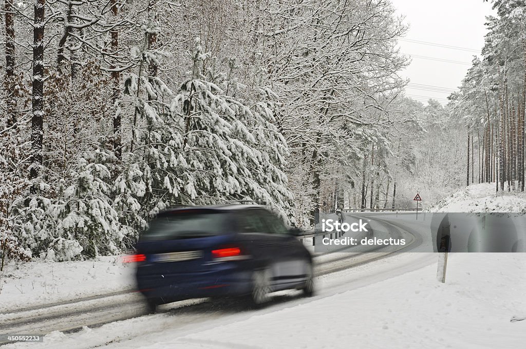 Traffic on a wintry road Car ctation wagon on a wintry road. Long exposure Car Stock Photo