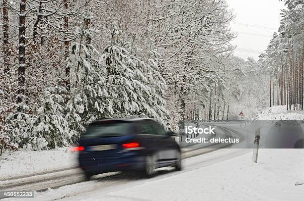 Traffic On A Wintry Road Stock Photo - Download Image Now - Car, Country Road, Curve