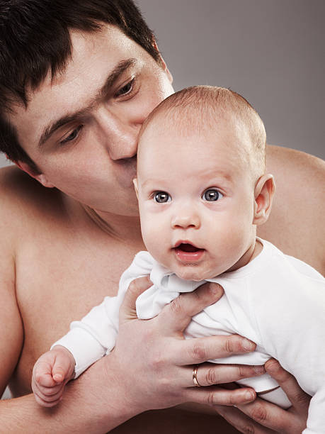istock father with his baby boy 450559463