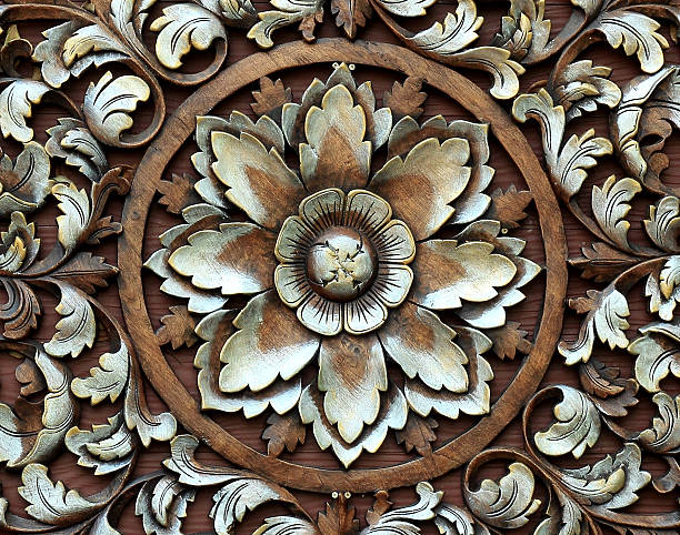 istock Pattern of flower carved on wood background 450564337