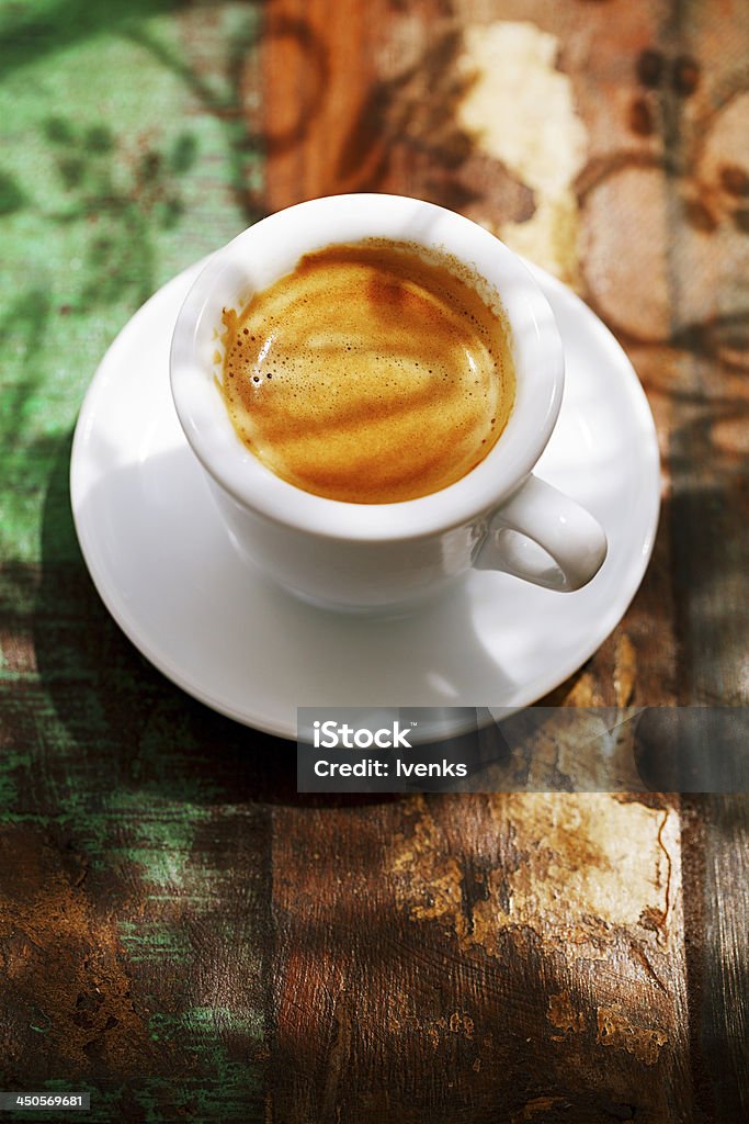 espresso coffee cup on rustic table with sun Black Coffee Stock Photo