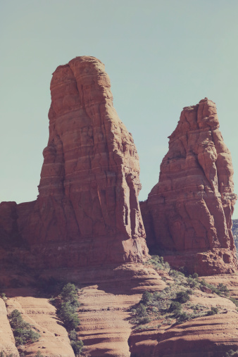 A vintage styled photo of the red rock peaks of Sedona, Arizona, desert and rugged rock background.