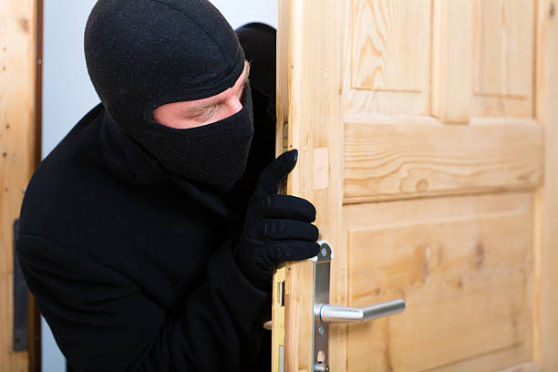 istock Burglary - culprit opens a door 450575947