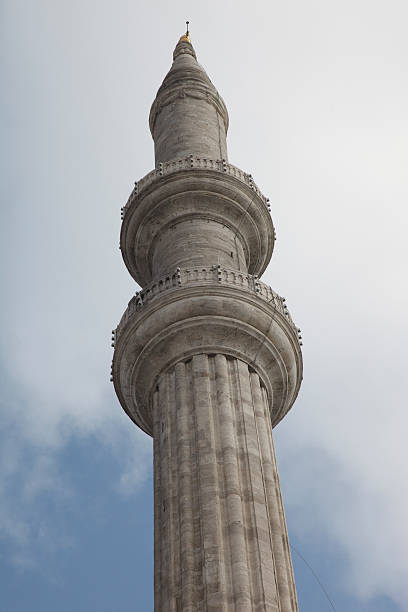Minaret at Beyazit Mosque with clouds stock photo