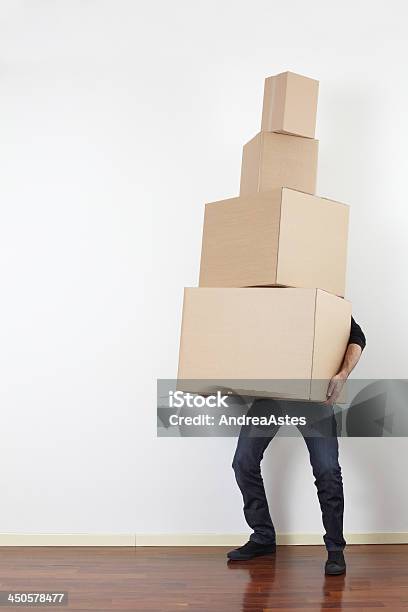 Man Lifting Cardboard Boxes Moving Day Stock Photo - Download Image Now - Carrying, Moving Office, Box - Container