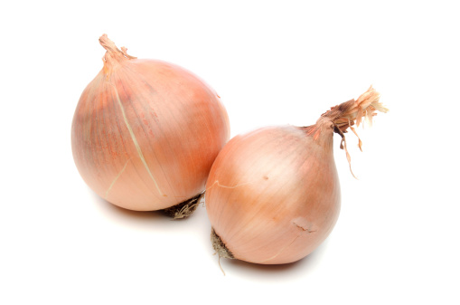 Two onions on white background.