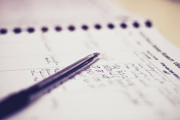 istock Pen and guestbook with handwriting 450597431