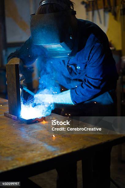 Welder With Welding Sparks Stock Photo - Download Image Now - Blue, Blue-collar Worker, Busy