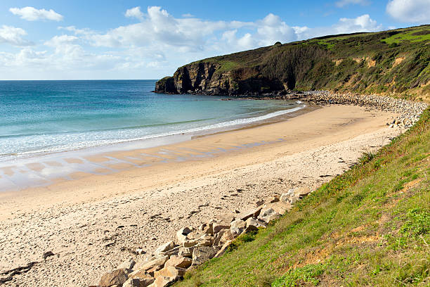 istock Praa Sands beach Cornwall England with blue sky and sea 450603175