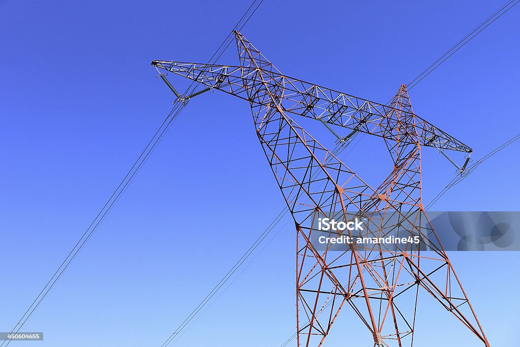 electricity pylon on an electricity pylon against blue sky for a renewable electricity or nuclear Amperage Stock Photo