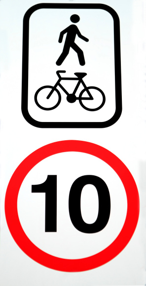 Sign with a speed limit for a bicycle path of 10 due to it being shared with pedestrians on white background