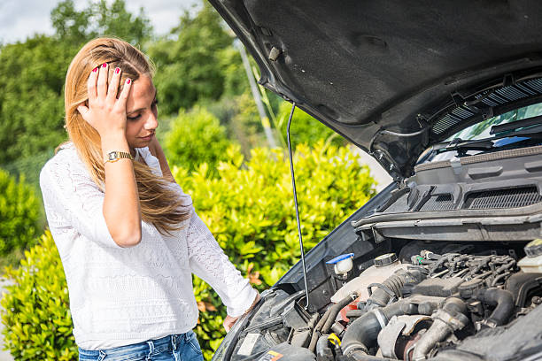 istock Young Woman with Damaged Car 450613761