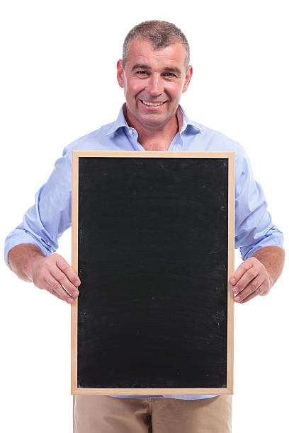 istock casual middle aged man holding chalkboard 450614443