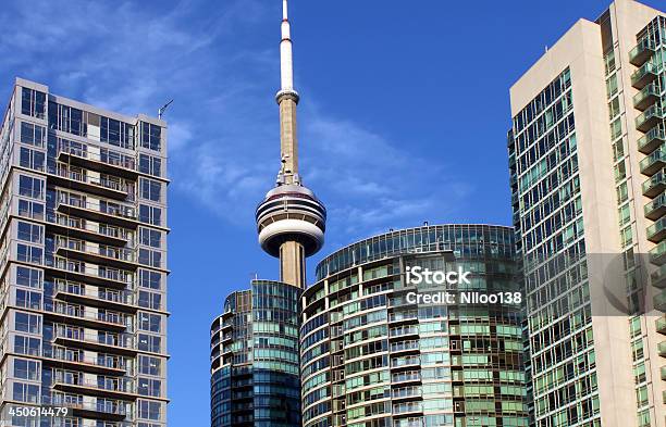Cn Tower And Residential Buildings Against Blue Sky Stock Photo - Download Image Now