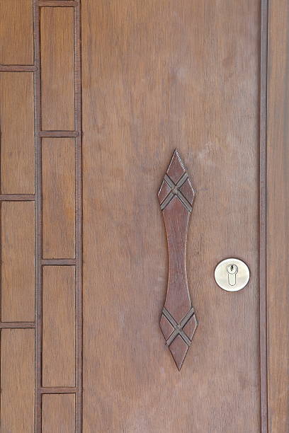 Modren style door handle on natural wooden door
