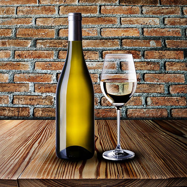 istock Bottle and Glass of white wine 450644343