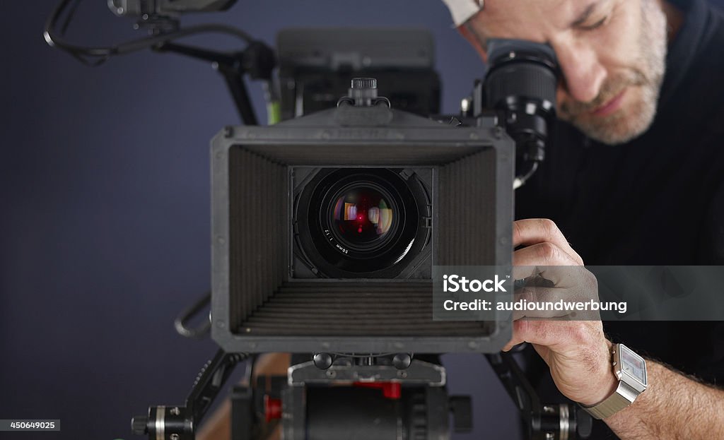 cameraman working with a cinema camera Home Video Camera Stock Photo