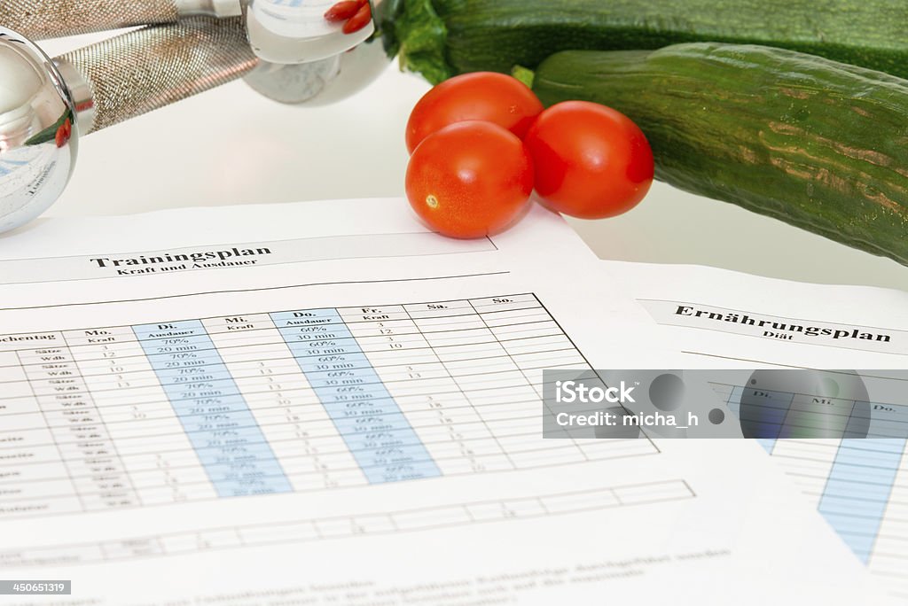 Living healthier with vegetables Training plan, vegetables and dumbbells Broadcast Music Incorporated Stock Photo