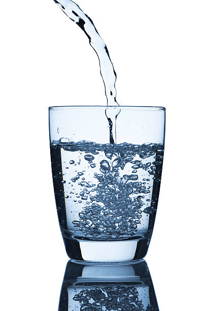 istock Water pouring to glass 450652203
