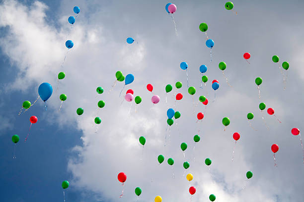 istock Balloons flying in the sky 450653087