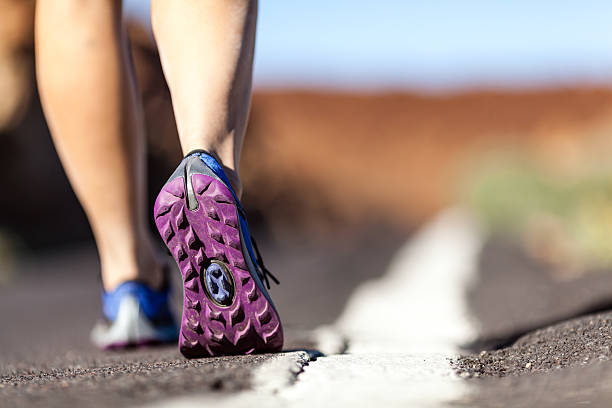 istock Walking or running legs in mountains, adventure and exercising 450661525