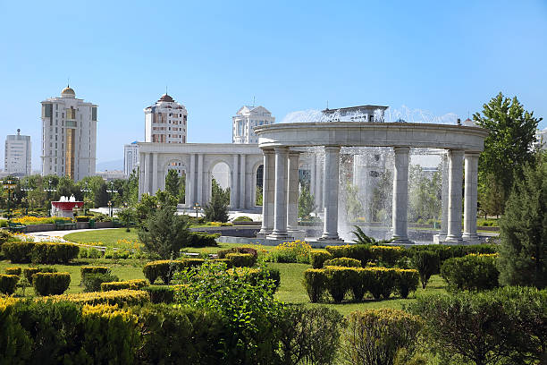 istock Modern apartamentes behind a young park with  fountain complex. 450662561