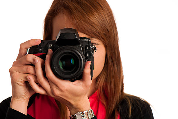 istock Young woman photographer with camera in her hand 450664535
