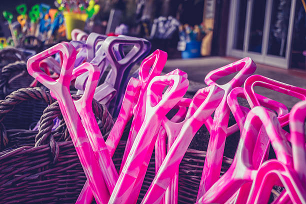 istock Basket with colorful plastic shovels at beach 450664905